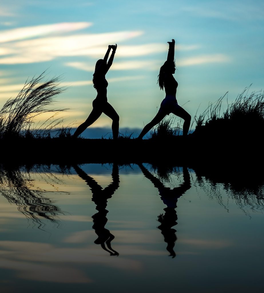 women, yoga, silhouettes, water, reflection, mirroring, water reflection, pose, posing, yoga pose, meditation, stretching, nature, wellness, well-being, exercise, adults, asia, girls, morning, outdoors, pair, people, stance, sunrise, sunset